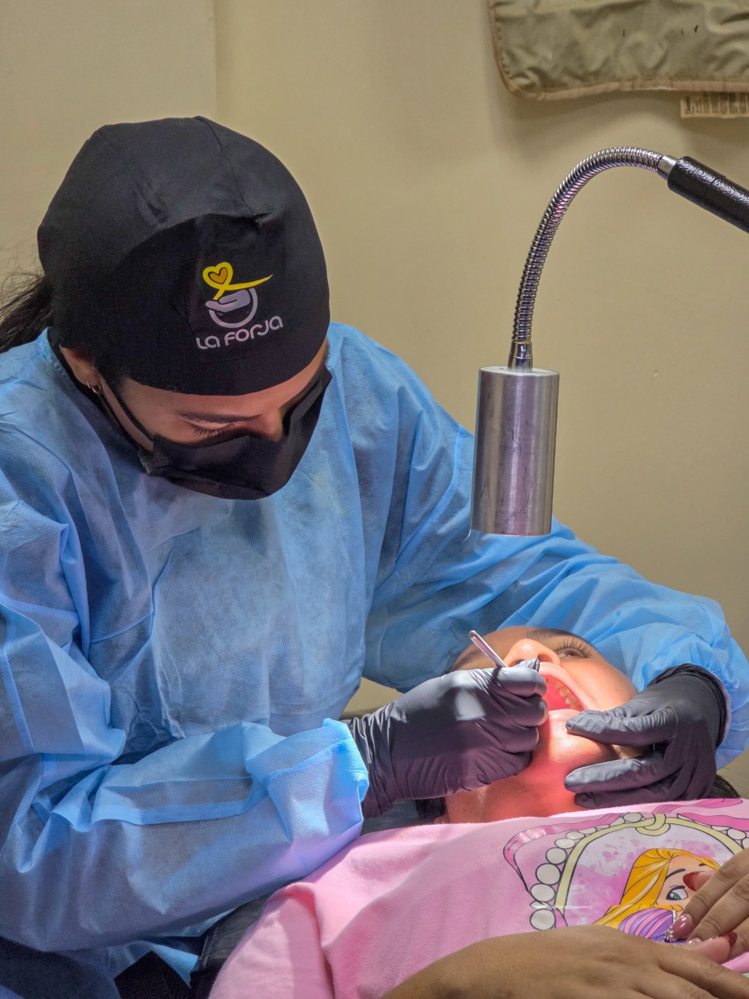 La Forja Foundation doctor performing a medical check-up on a young girl during the Consejo de Ciruma health drive.