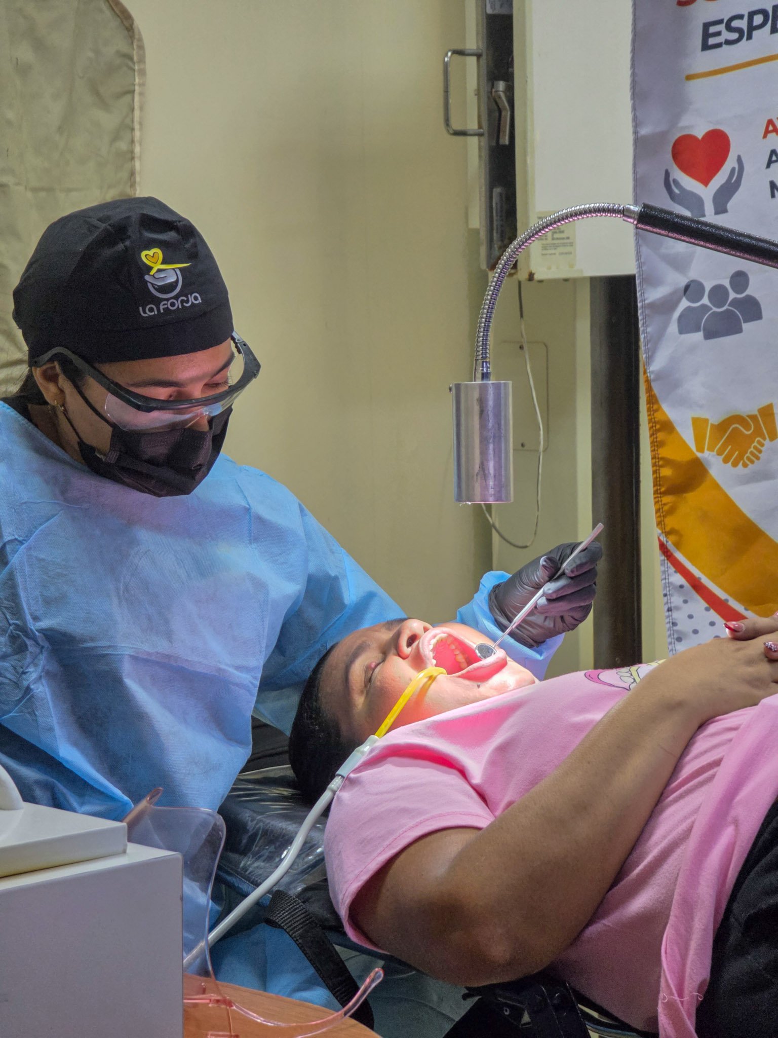 La Forja Foundation doctor performing a medical check-up on a young girl during the Consejo de Ciruma health drive.