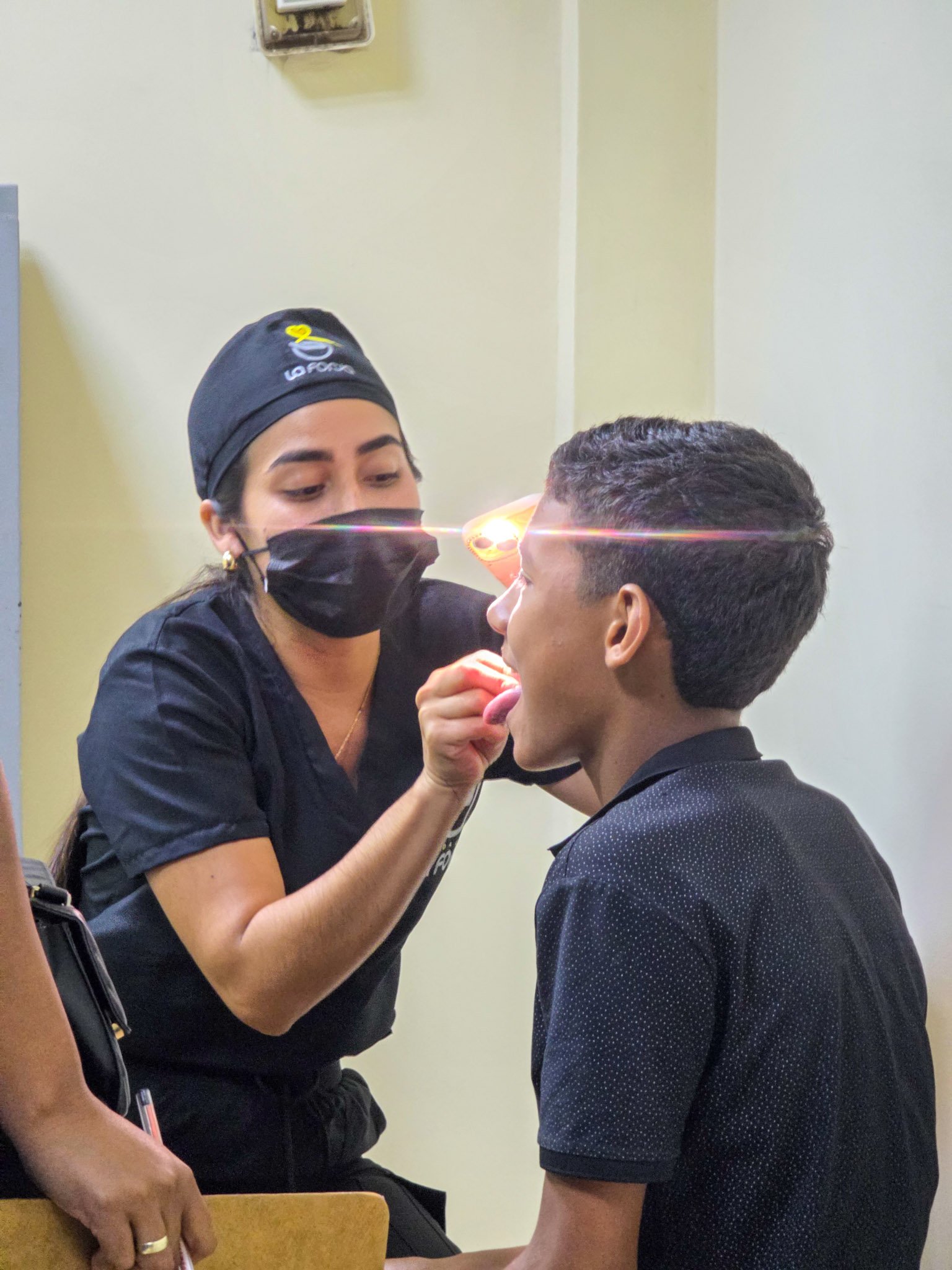La Forja Foundation doctor performing a medical check-up on a young girl during the Consejo de Ciruma health drive.