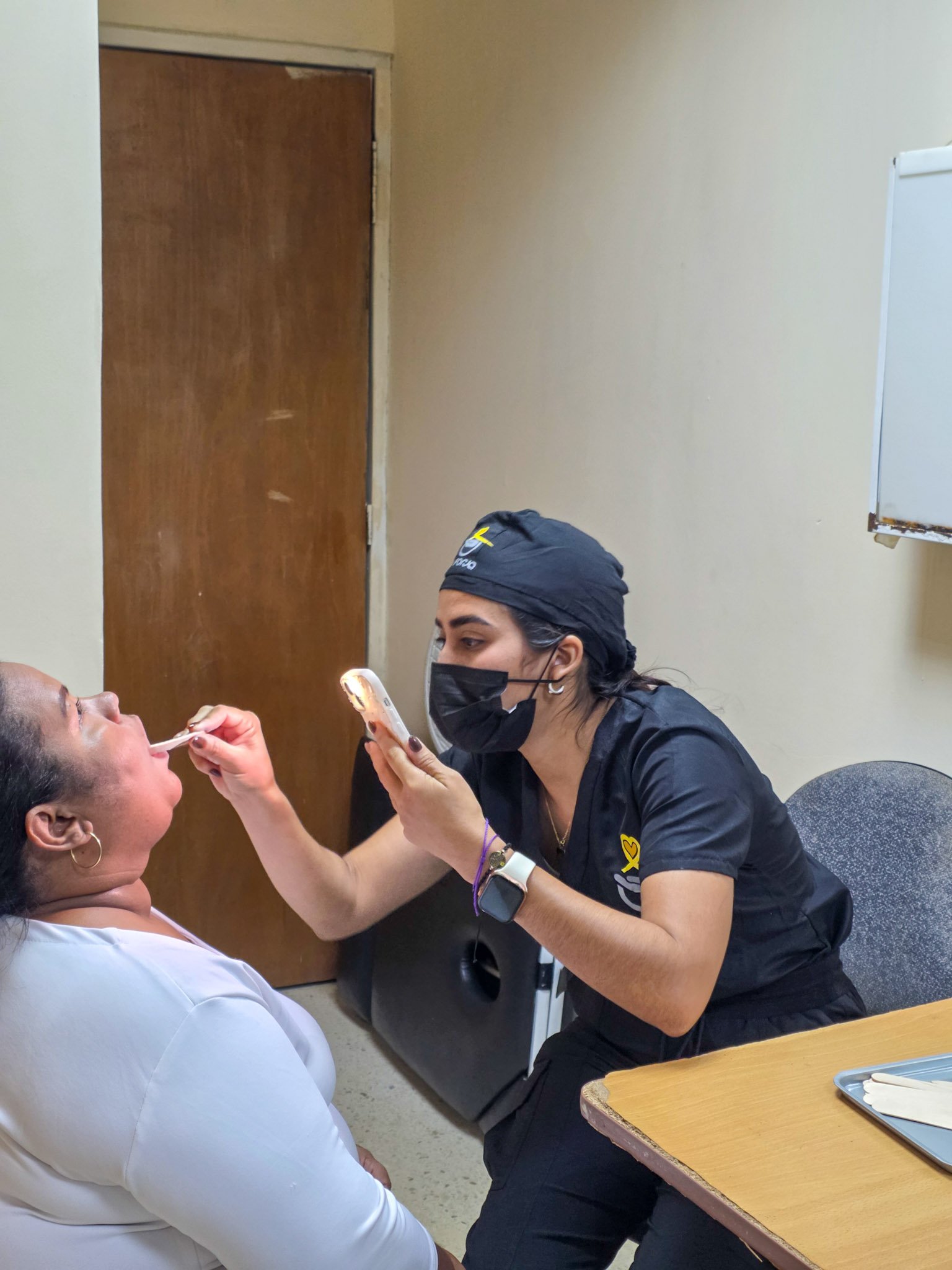 La Forja Foundation doctor performing a medical check-up on a young girl during the Consejo de Ciruma health drive.
