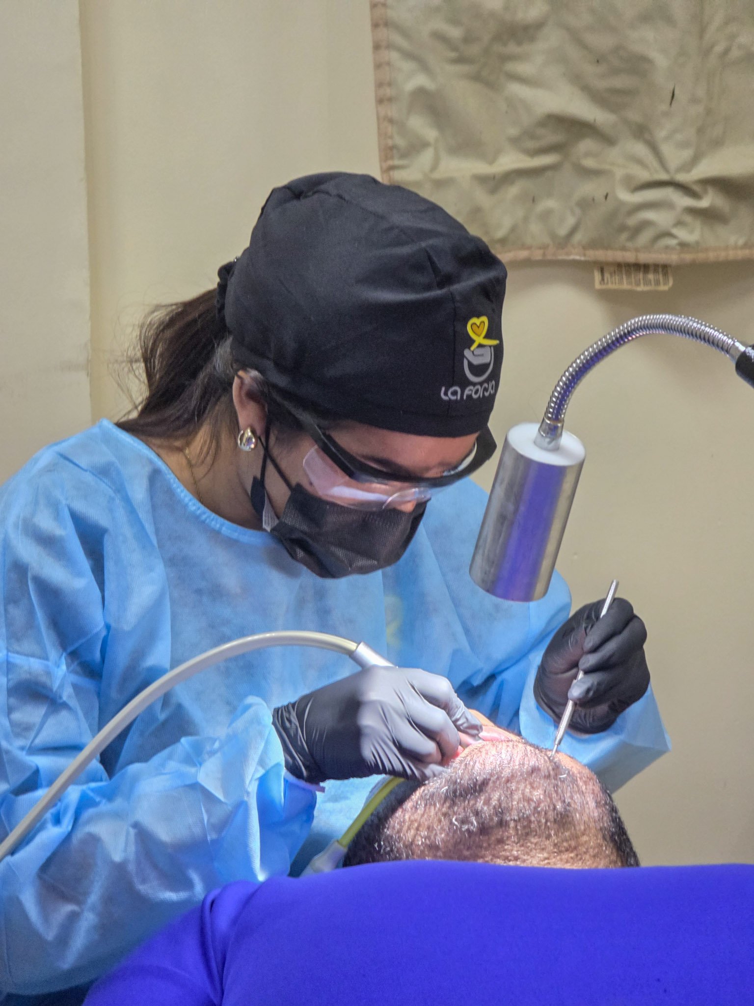 La Forja Foundation doctor performing a medical check-up on a young girl during the Consejo de Ciruma health drive.